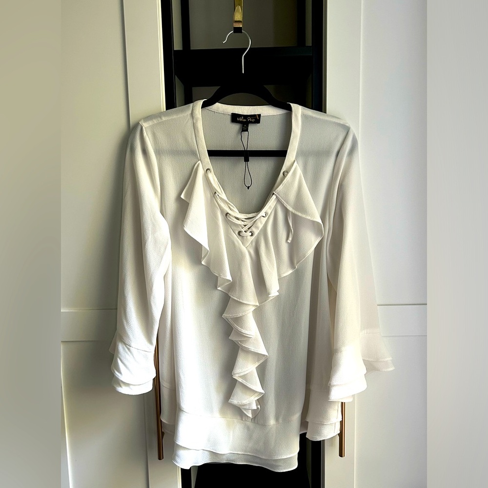 Ivory blouse with tie-up string v-neck. By Melissa Paige size M.